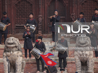 A Nepali musical band dons Newari attire and plays traditional musical instruments during the sacred pole Ya:shi erection procession at Kath...