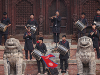 A Nepali musical band dons Newari attire and plays traditional musical instruments during the sacred pole Ya:shi erection procession at Kath...