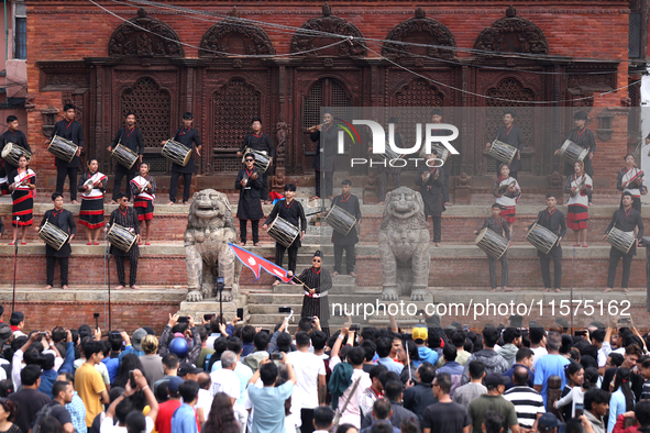 A Nepali musical band dons Newari attire and plays traditional musical instruments ahead of the formal start of Indra Jatra dedicated to the...