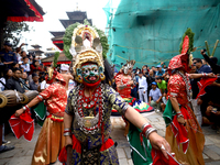 Masked dancers perform a ritualistic dance at Kathmandu Durbar Square during the procession of erecting a sacred pole locally called ''Ya: S...