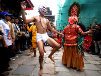 Masked dancers perform a ritualistic dance at Kathmandu Durbar Square during the procession of erecting a sacred pole locally called ''Ya: S...