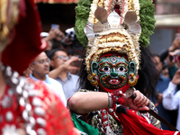 Masked dancers perform a ritualistic dance at Kathmandu Durbar Square during the procession of erecting a sacred pole locally called ''Ya: S...