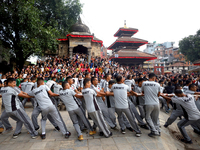 Nepali Hindu devotees pull a sacred pole locally called ''Ya: Shi,'' marking the formal start of Indra Jatra dedicated to the rain god Indra...