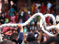 Nepali Hindu devotees pull a sacred pole locally called ''Ya: Shi,'' marking the formal start of Indra Jatra dedicated to the rain god Indra...