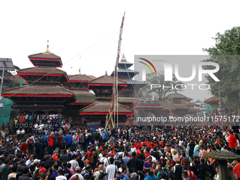 Nepali Hindu devotees pull a sacred pole locally called ''Ya: Shi,'' marking the formal start of Indra Jatra dedicated to the rain god Indra...