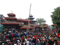 Nepali Hindu devotees pull a sacred pole locally called ''Ya: Shi,'' marking the formal start of Indra Jatra dedicated to the rain god Indra...