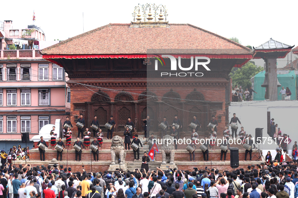 A Nepali musical band dons Newari attire and plays traditional musical instruments ahead of the formal start of Indra Jatra dedicated to the...