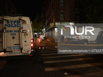 The crime scene unit is on the scene. One man is dead and another man is injured but is expected to survive after a shooting in Bronx, New Y...