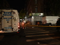 The crime scene unit is on the scene. One man is dead and another man is injured but is expected to survive after a shooting in Bronx, New Y...