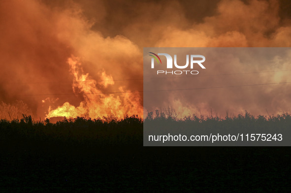 Fire crews work to put out a fire at a wood processing plant in Duzhuang village, Wan'an Town, Xinjiang County, Yuncheng City, North China's...