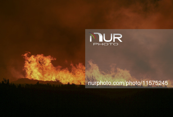 Fire crews work to put out a fire at a wood processing plant in Duzhuang village, Wan'an Town, Xinjiang County, Yuncheng City, North China's...