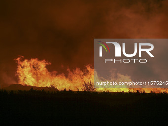 Fire crews work to put out a fire at a wood processing plant in Duzhuang village, Wan'an Town, Xinjiang County, Yuncheng City, North China's...