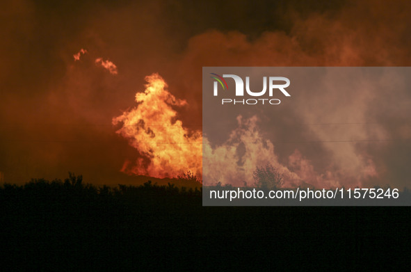 Fire crews work to put out a fire at a wood processing plant in Duzhuang village, Wan'an Town, Xinjiang County, Yuncheng City, North China's...