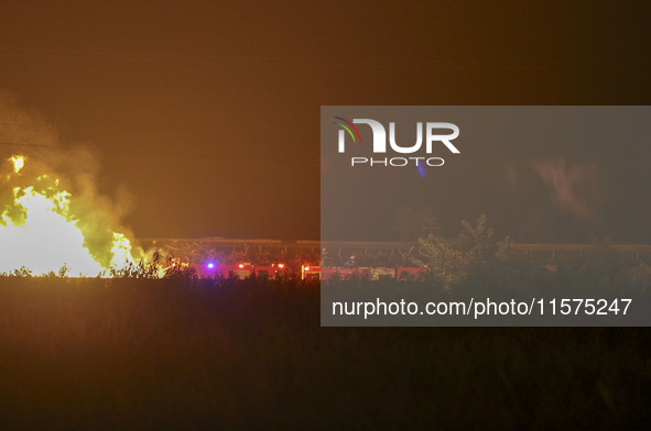 Fire crews work to put out a fire at a wood processing plant in Duzhuang village, Wan'an Town, Xinjiang County, Yuncheng City, North China's...