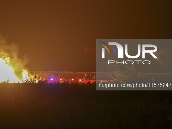 Fire crews work to put out a fire at a wood processing plant in Duzhuang village, Wan'an Town, Xinjiang County, Yuncheng City, North China's...