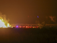 Fire crews work to put out a fire at a wood processing plant in Duzhuang village, Wan'an Town, Xinjiang County, Yuncheng City, North China's...