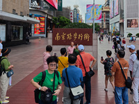 Tourists are seen on the Nanjing Road Pedestrian Street on the first day of the Mid-Autumn Festival holiday in Shanghai, China, on September...