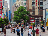 Tourists are seen on the Nanjing Road Pedestrian Street on the first day of the Mid-Autumn Festival holiday in Shanghai, China, on September...