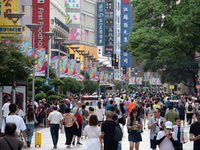 Tourists are seen on the Nanjing Road Pedestrian Street on the first day of the Mid-Autumn Festival holiday in Shanghai, China, on September...