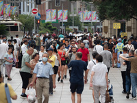 Tourists are seen on the Nanjing Road Pedestrian Street on the first day of the Mid-Autumn Festival holiday in Shanghai, China, on September...