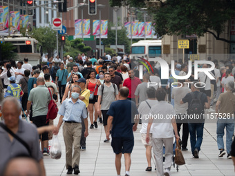 Tourists are seen on the Nanjing Road Pedestrian Street on the first day of the Mid-Autumn Festival holiday in Shanghai, China, on September...