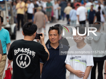 Tourists are seen on the Nanjing Road Pedestrian Street on the first day of the Mid-Autumn Festival holiday in Shanghai, China, on September...