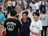 Tourists are seen on the Nanjing Road Pedestrian Street on the first day of the Mid-Autumn Festival holiday in Shanghai, China, on September...