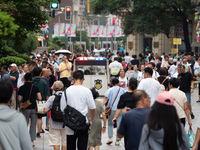 Tourists are seen on the Nanjing Road Pedestrian Street on the first day of the Mid-Autumn Festival holiday in Shanghai, China, on September...