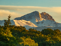 Snowy Corno Grande peak (Gran Sasso d’Italia and Monti della Laga National Park) is seen above trees after a snowfall from Ocre (L’Aquila),...