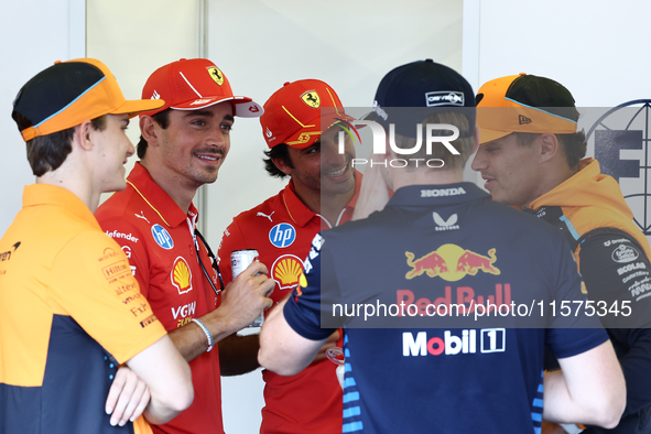 Lando Norris of McLaren, Charles Leclerc, Carlos Sainz of Ferrari, Max Verstappen of Red Bull Racing and Lando Norris of McLaren ahead of th...