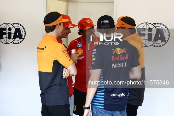 Lando Norris of McLaren, Charles Leclerc, Carlos Sainz of Ferrari, Max Verstappen of Red Bull Racing and Lando Norris of McLaren ahead of th...