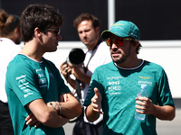 Lance Stroll and Fernando Alonso of Aston Martin Aramco ahead of the Formula 1 Grand Prix of Azerbaijan at Baku City Circuit in Baku, Azerba...