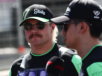 Valtteri Bottas and Zhou Guanyu of Kick Sauber ahead of the Formula 1 Grand Prix of Azerbaijan at Baku City Circuit in Baku, Azerbaijan on S...