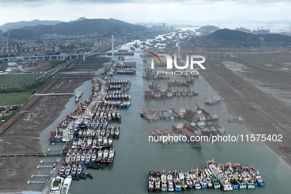 A large number of fishing boats moor at Shenjiamen Fishing Port to avoid Typhoon Bebinca in Zhoushan, China, on September 15, 2024. 