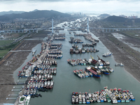 A large number of fishing boats moor at Shenjiamen Fishing Port to avoid Typhoon Bebinca in Zhoushan, China, on September 15, 2024. (