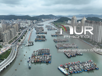 A large number of fishing boats moor at Shenjiamen Fishing Port to avoid Typhoon Bebinca in Zhoushan, China, on September 15, 2024. (