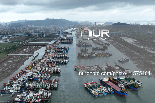 A large number of fishing boats moor at Shenjiamen Fishing Port to avoid Typhoon Bebinca in Zhoushan, China, on September 15, 2024. 