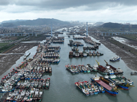 A large number of fishing boats moor at Shenjiamen Fishing Port to avoid Typhoon Bebinca in Zhoushan, China, on September 15, 2024. (