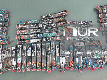 A large number of fishing boats moor at Shenjiamen Fishing Port to avoid Typhoon Bebinca in Zhoushan, China, on September 15, 2024. (