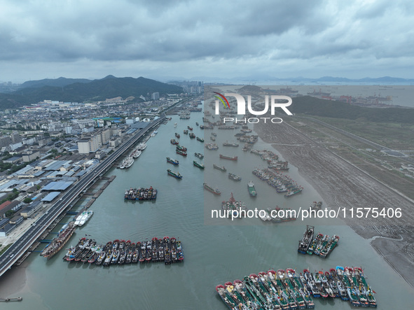 A large number of fishing boats moor at Shenjiamen Fishing Port to avoid Typhoon Bebinca in Zhoushan, China, on September 15, 2024. 