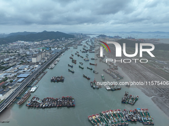 A large number of fishing boats moor at Shenjiamen Fishing Port to avoid Typhoon Bebinca in Zhoushan, China, on September 15, 2024. (