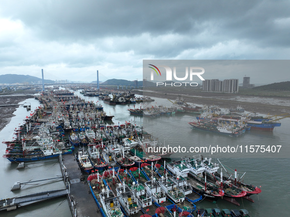 A large number of fishing boats moor at Shenjiamen Fishing Port to avoid Typhoon Bebinca in Zhoushan, China, on September 15, 2024. 