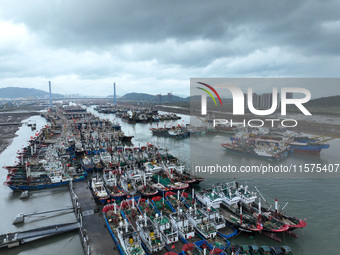 A large number of fishing boats moor at Shenjiamen Fishing Port to avoid Typhoon Bebinca in Zhoushan, China, on September 15, 2024. (