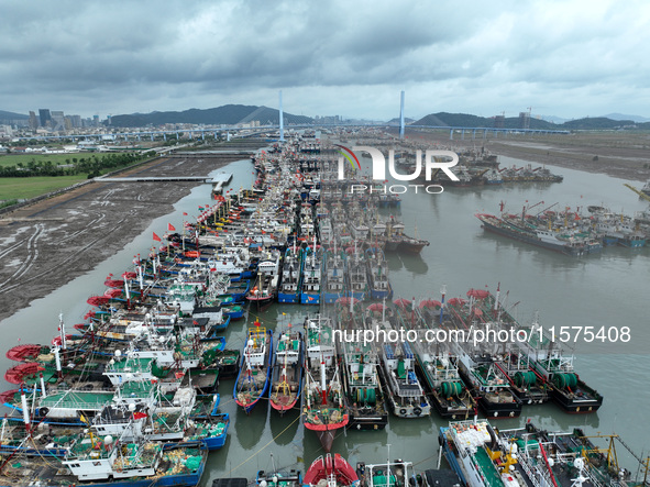 A large number of fishing boats moor at Shenjiamen Fishing Port to avoid Typhoon Bebinca in Zhoushan, China, on September 15, 2024. 