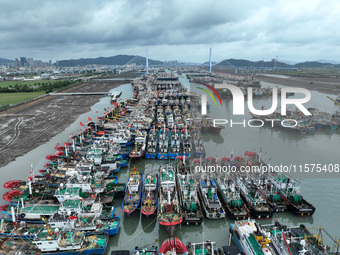 A large number of fishing boats moor at Shenjiamen Fishing Port to avoid Typhoon Bebinca in Zhoushan, China, on September 15, 2024. (