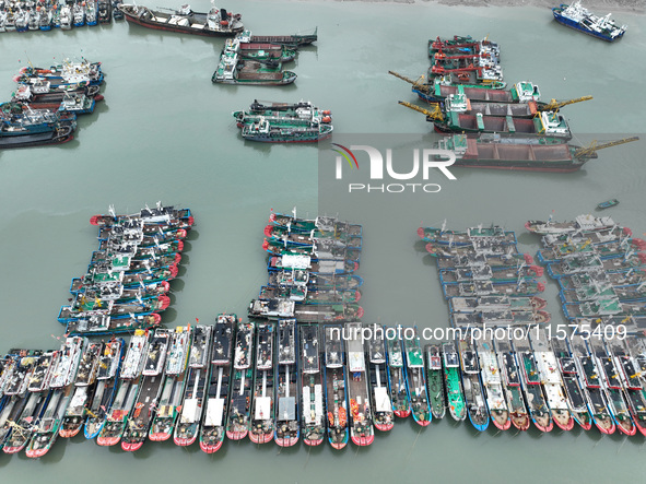 A large number of fishing boats moor at Shenjiamen Fishing Port to avoid Typhoon Bebinca in Zhoushan, China, on September 15, 2024. 