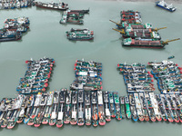 A large number of fishing boats moor at Shenjiamen Fishing Port to avoid Typhoon Bebinca in Zhoushan, China, on September 15, 2024. (