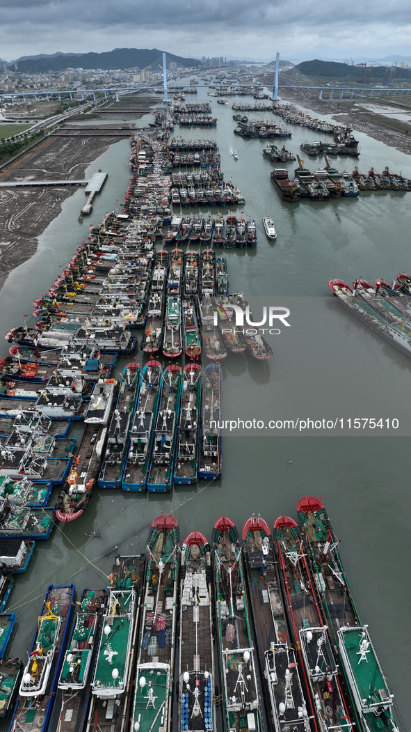 A large number of fishing boats moor at Shenjiamen Fishing Port to avoid Typhoon Bebinca in Zhoushan, China, on September 15, 2024. 