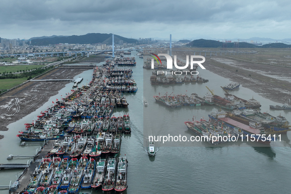 A large number of fishing boats moor at Shenjiamen Fishing Port to avoid Typhoon Bebinca in Zhoushan, China, on September 15, 2024. 