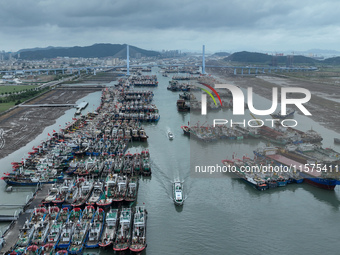 A large number of fishing boats moor at Shenjiamen Fishing Port to avoid Typhoon Bebinca in Zhoushan, China, on September 15, 2024. (